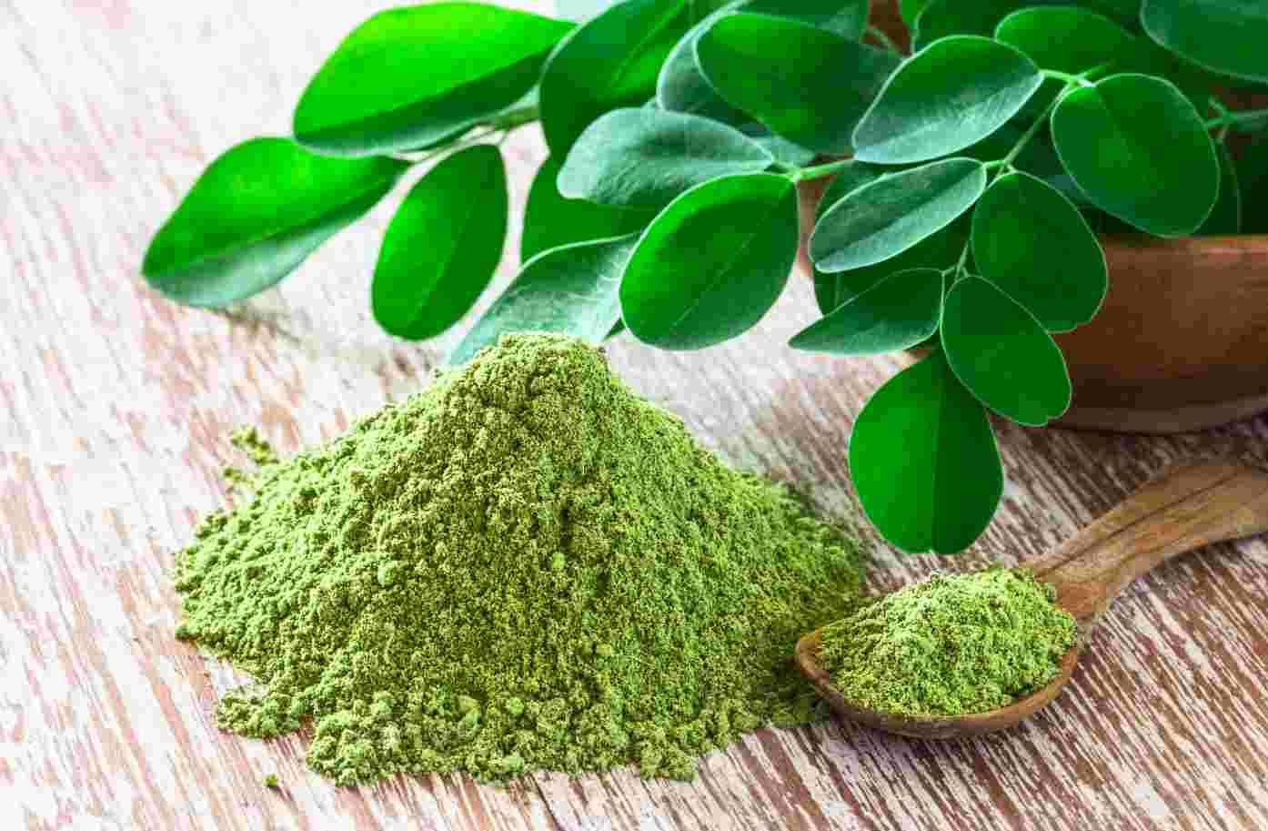 Moringa powder and leaves, rich in vitamins and antioxidants for improved health.