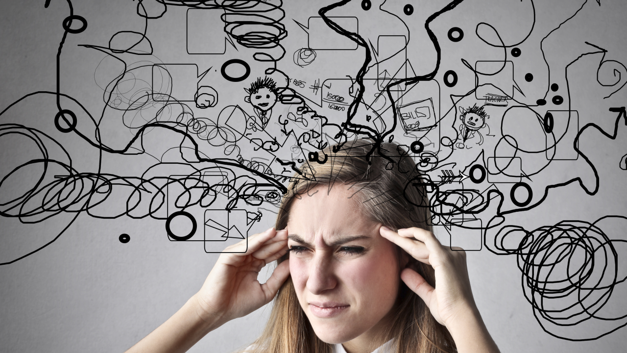 Person looking thoughtful, head surrounded by scribbles